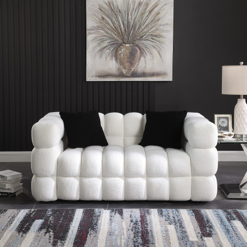 Premium sofa set featuring a modern white design with black cushions, perfect for contemporary living spaces.