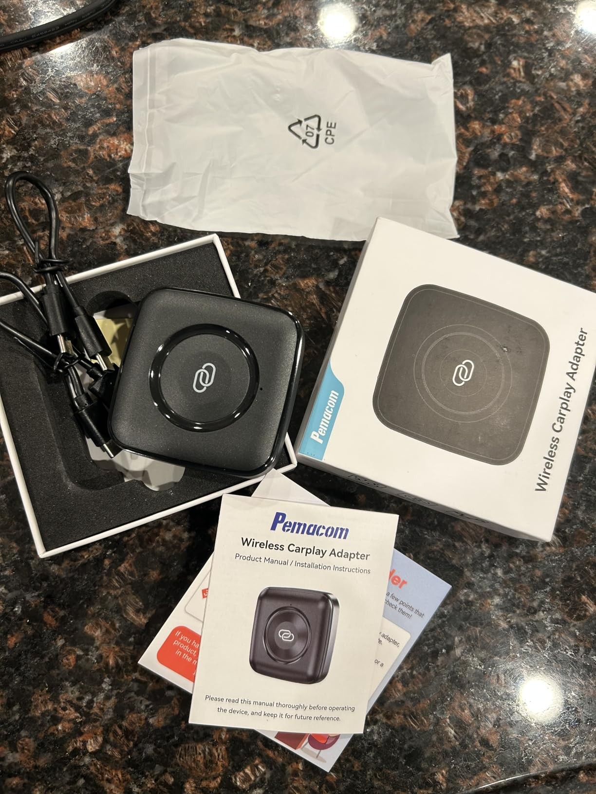 Wireless carplay adapter by pemacom, featuring sleek design and easy setup for seamless device connectivity.