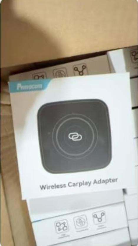Wireless carplay adapter for iphone, compatible with modern vehicles, enhancing connectivity effortlessly.